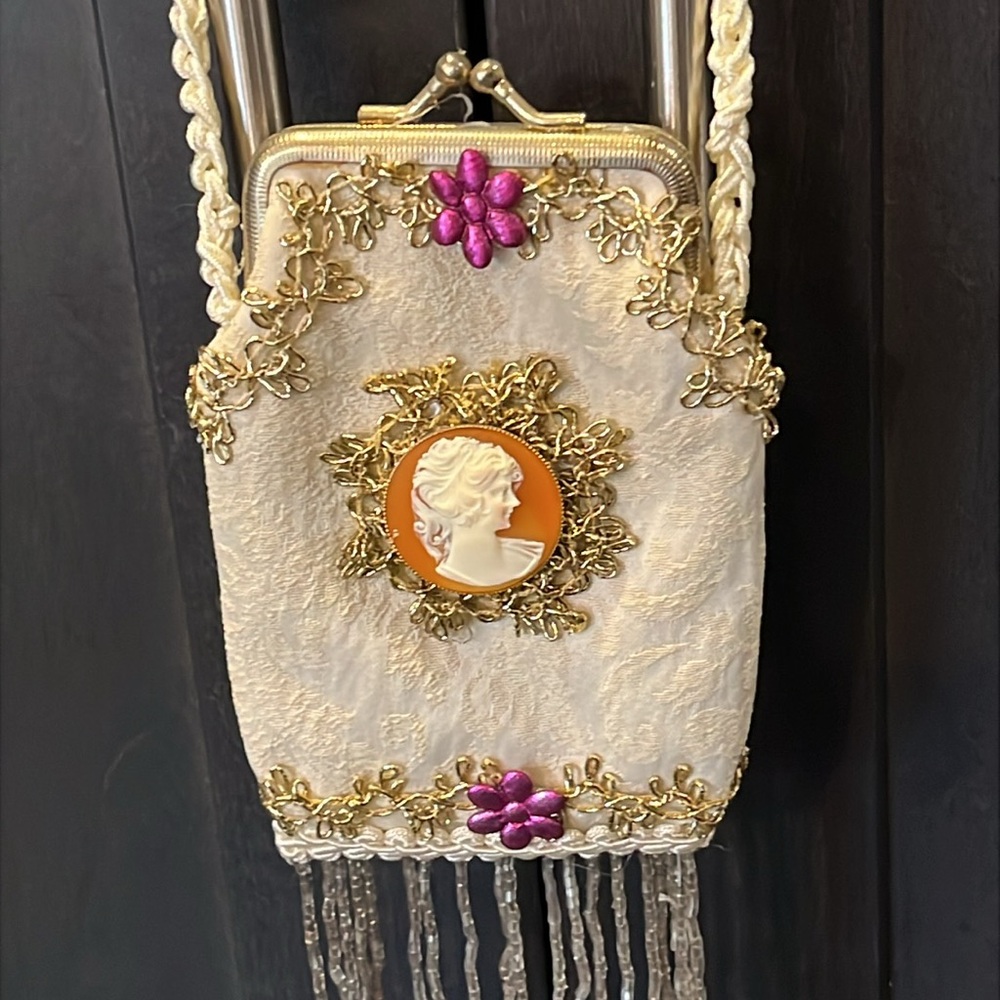 Elegant Cream and Gold Embellished Novelty Bag. Beaded fringe. Center Cameo.